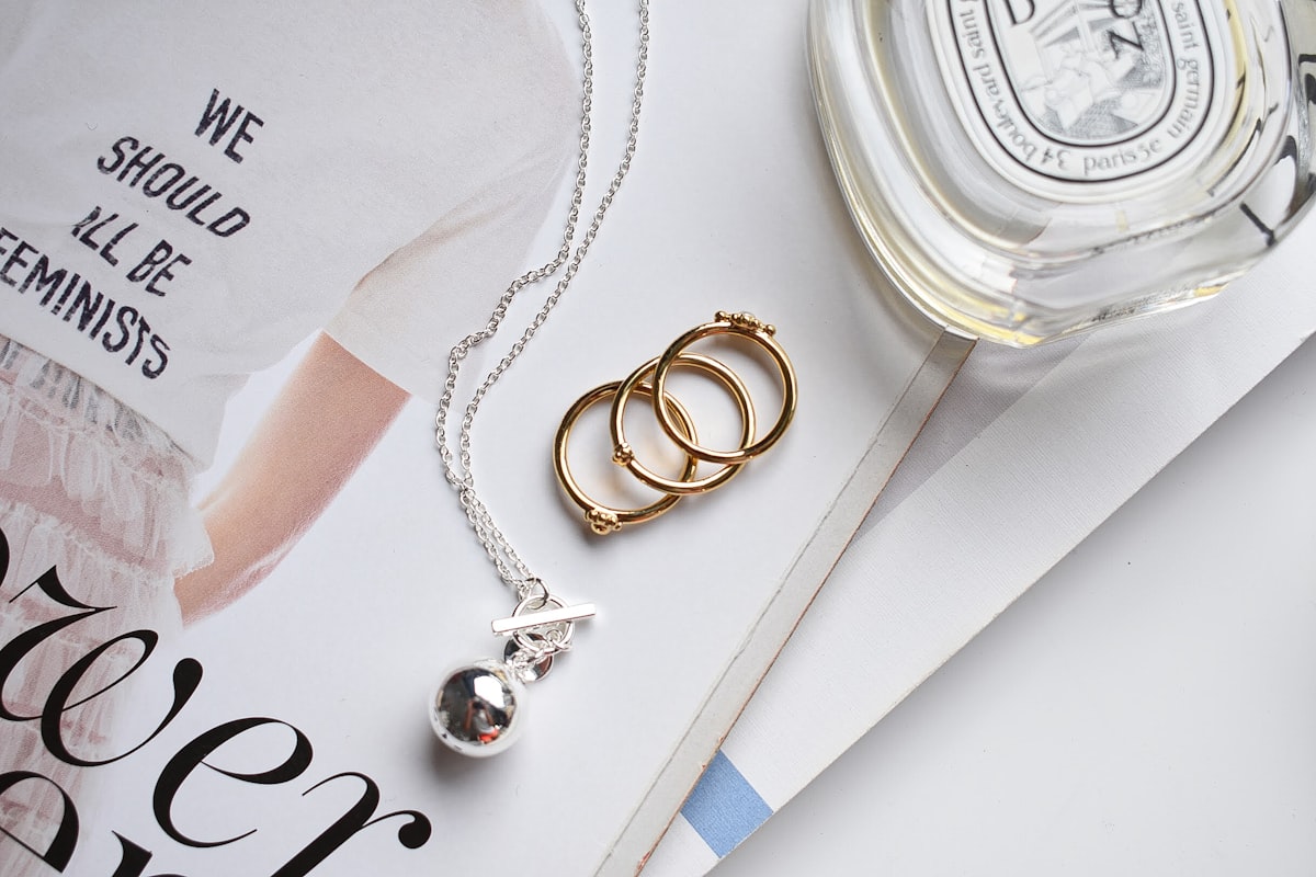 Silver and gold bracelet on white paper demonstrating mixed metal jewelry styling