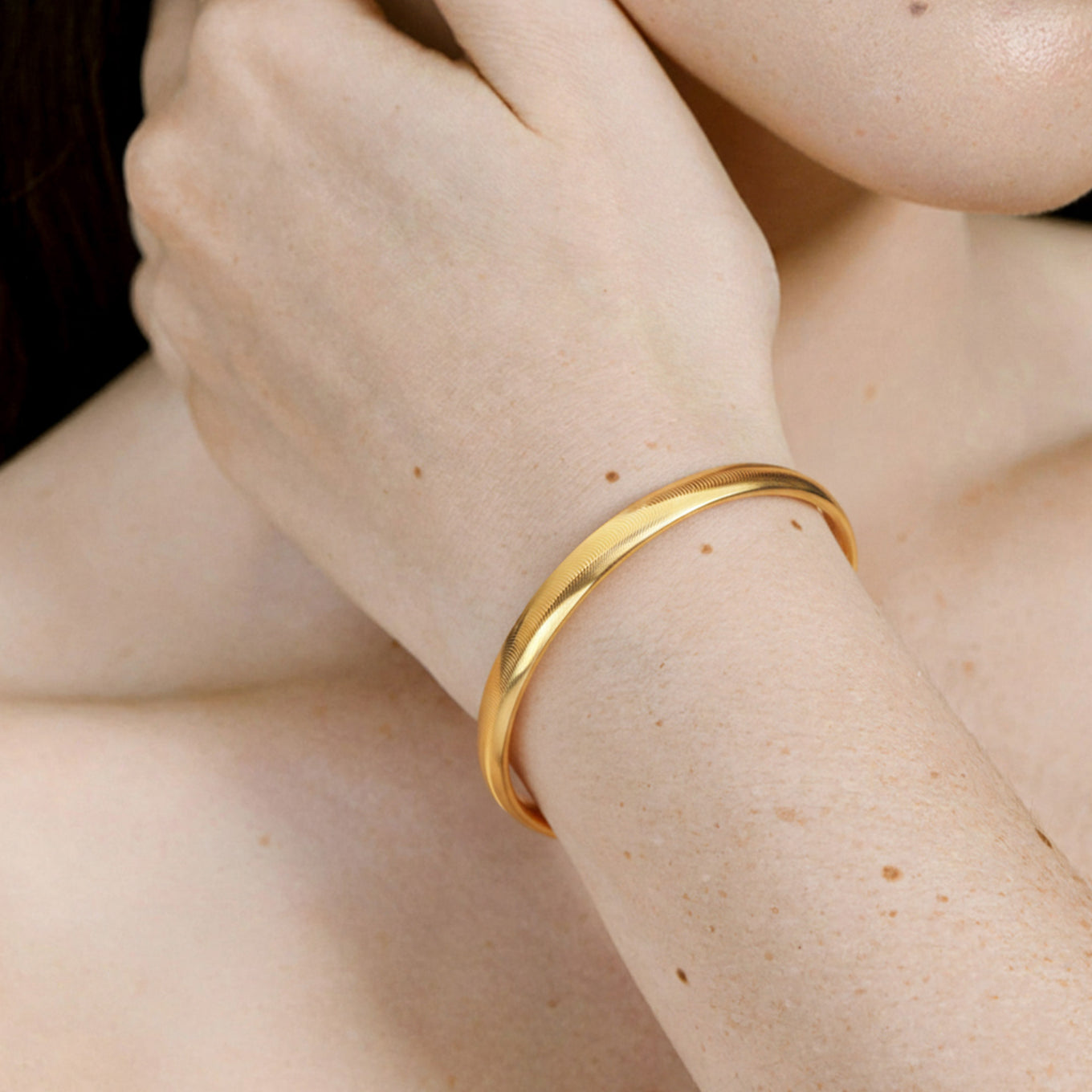 Gold moire bangle bracelet water ripple texture dual surface design minimalist everyday jewelry quiet luxury