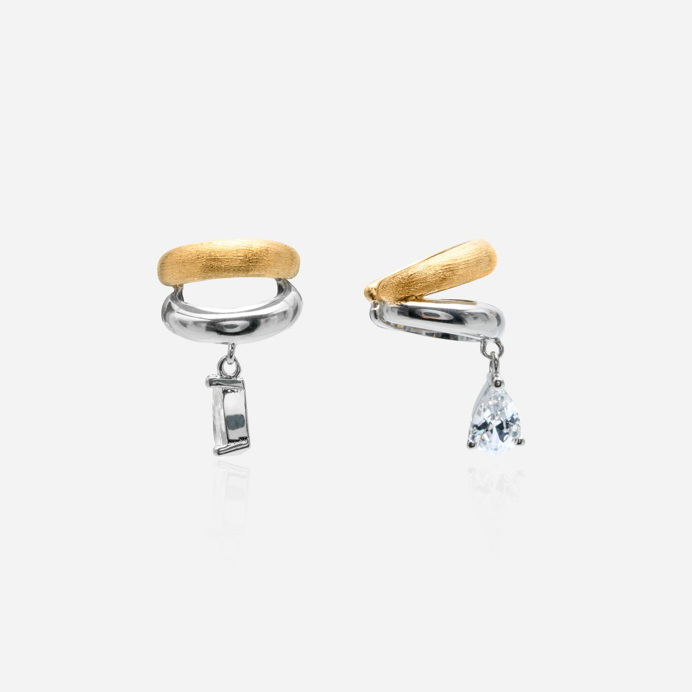 A two-tone gold and silver helix ear cuff featuring a brushed texture and a dangling pear-cut lab diamond | ÉLARAMUSE