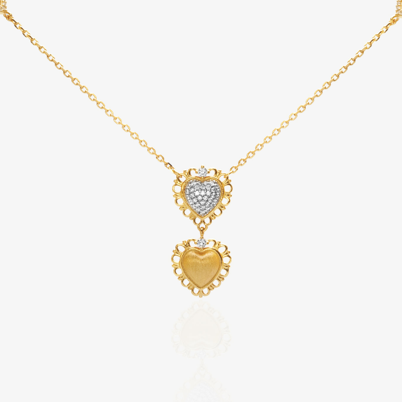 Double Heart Gold Pendant Necklace — two-tone pavé lab diamond upper heart layered over matte brushed gold lower heart, scalloped lace-edge border, fine O-chain with side heart accents, 18K gold plated sterling silver