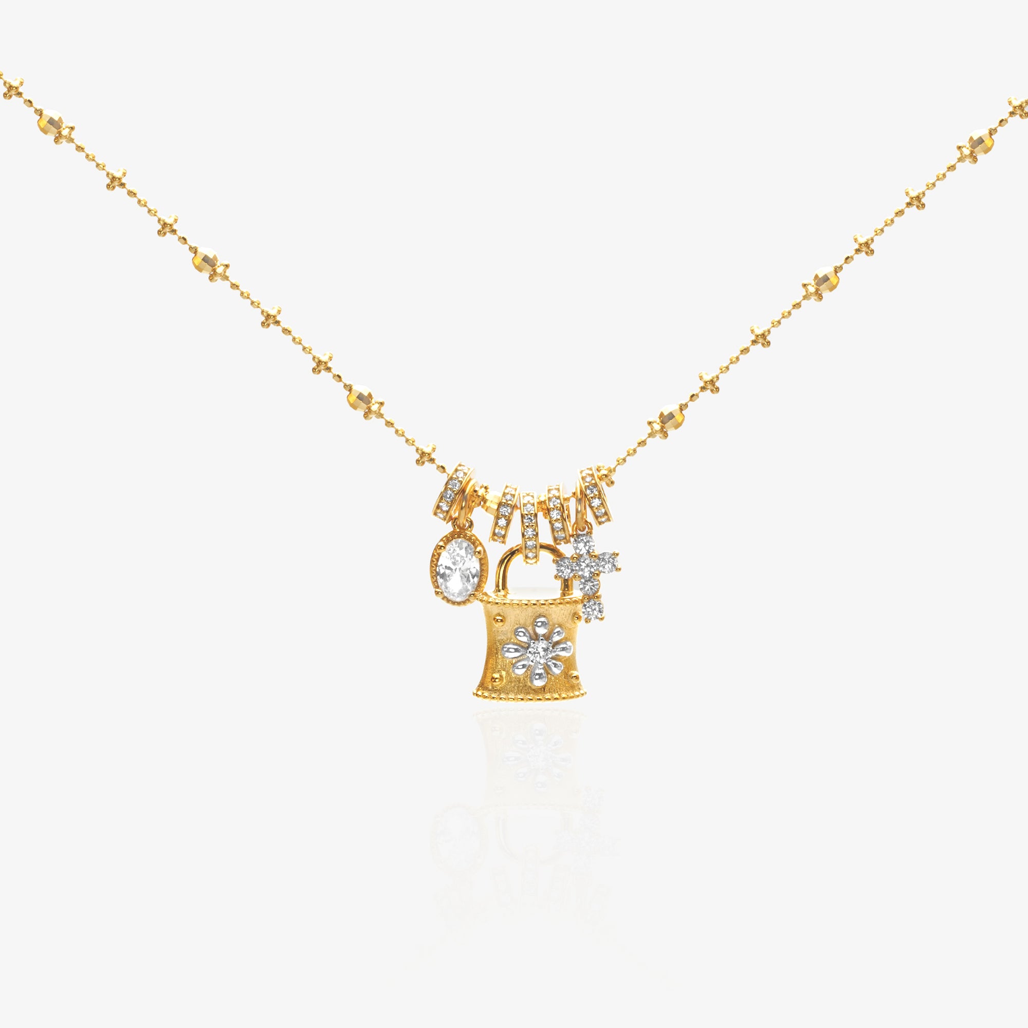 Gold Lock Charm Necklace — vintage padlock pendant with pavé snowflake diamond face, 4 detachable charms including marquise oval, cross star, and graduated baguette tassels, on beaded satellite chain, 18K gold plated sterling silver