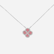 A reversible four-leaf clover necklace featuring a natural pink mother of pearl center surrounded by a brilliant lab