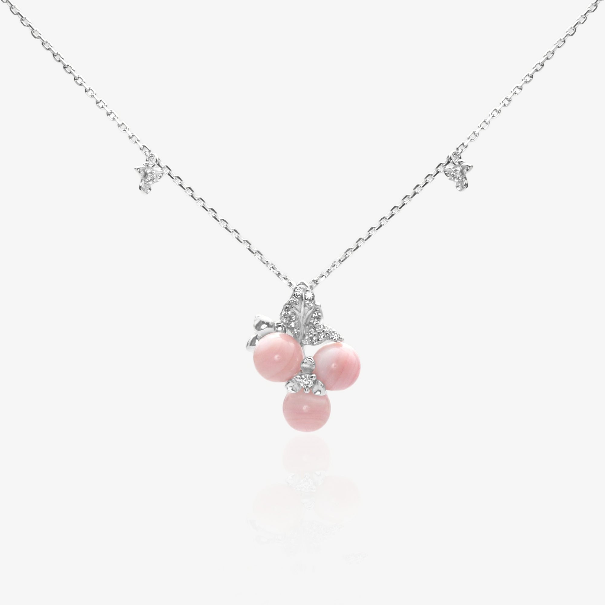 Queen Conch Shell botanical necklace featuring pink shell orbs and silver leaf motifs in 925 sterling silver.