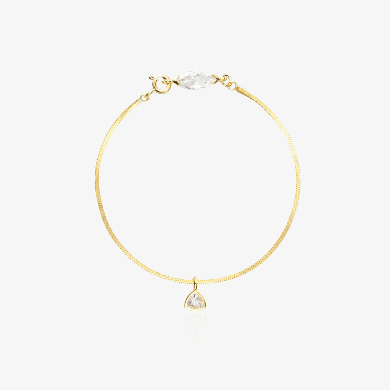 Gold Herringbone Bracelet — flat satin-brushed herringbone chain with horizontal marquise-cut lab diamond near lobster clasp and triangle geometric drop pendant, 18K gold-plated