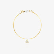 Gold Herringbone Bracelet — flat satin-brushed herringbone chain with horizontal marquise-cut lab diamond near lobster clasp and triangle geometric drop pendant, 18K gold-plated
