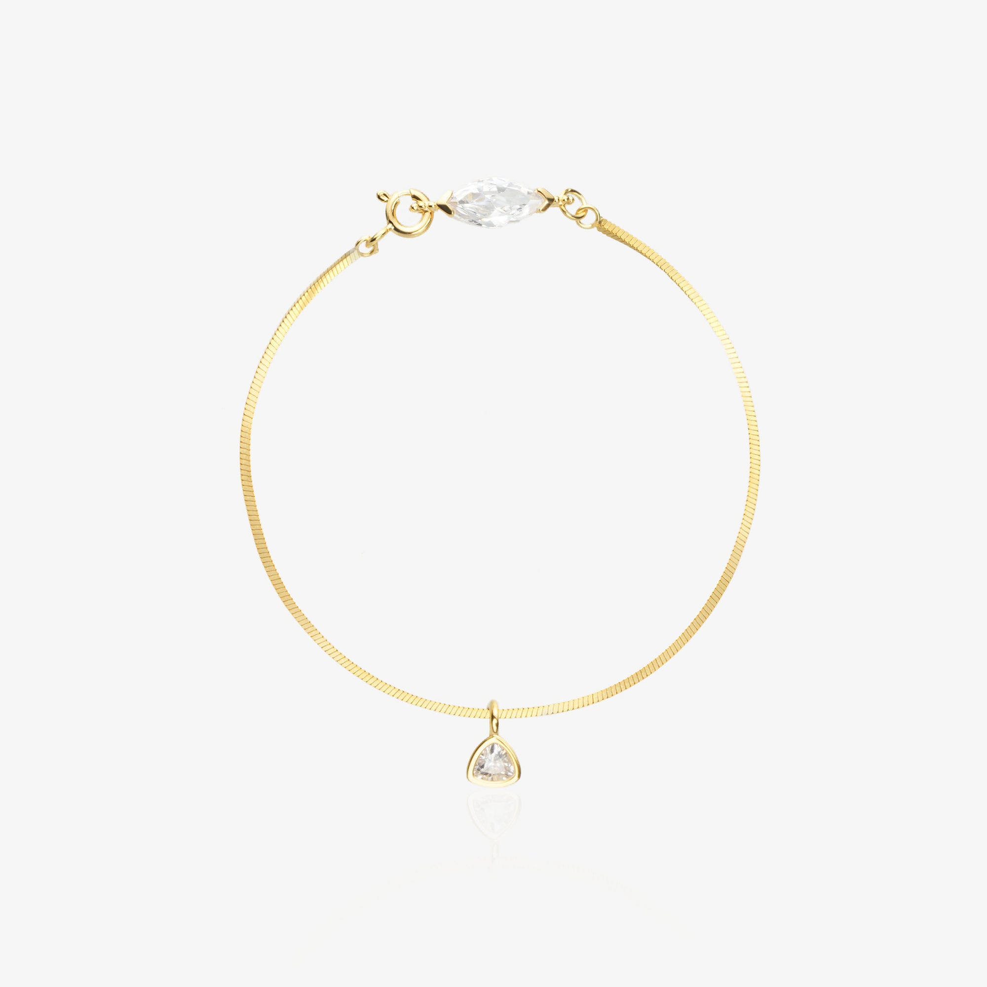 Gold Herringbone Bracelet — flat satin-brushed herringbone chain with horizontal marquise-cut lab diamond near lobster clasp and triangle geometric drop pendant, 18K gold-plated