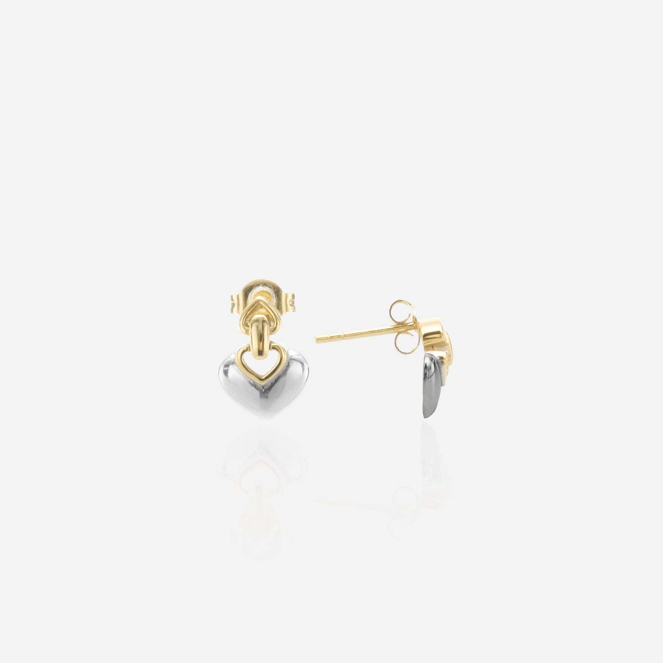 A pair of two-tone heart drop earrings featuring a gold knot stud and a polished silver heart dangle that moves freely