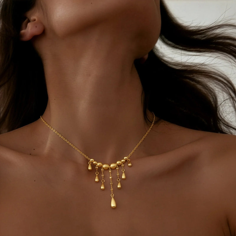 Gold teardrop fringe necklace Y-shaped design with 9 graduated drops mixed finish craftsmanship adjustable jewelry